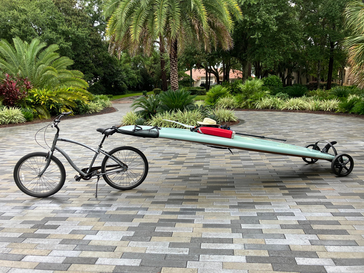 Happy SUP Wheels customer showing their paddle board bike tailer setup.