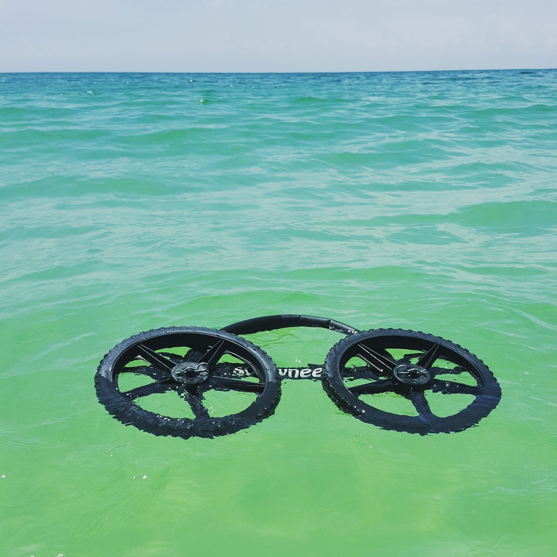SUP Wheels float in water. Picture on wheels in storage configuration floating in water.
